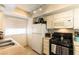 Functional kitchen with white cabinets, black appliances, and ample counter space at 555 Rene Ln, Henderson, NV 89015