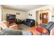 Comfortable living room with neutral walls, tile flooring, and a ceiling fan at 555 Rene Ln, Henderson, NV 89015