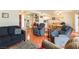 Open-concept layout with cozy living area with tile floors and furniture at 555 Rene Ln, Henderson, NV 89015