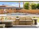 Inviting backyard oasis with a pool, waterfall feature, and comfortable seating area at 5865 Egan Crest Dr, Las Vegas, NV 89149