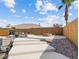 Inviting backyard pool and lounging area, fire pit, and desert landscaping at 5865 Egan Crest Dr, Las Vegas, NV 89149