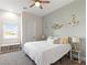 Bright bedroom with nautical decor, ceiling fan, and a window with a view at 5865 Egan Crest Dr, Las Vegas, NV 89149