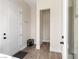 Functional entryway with shoe rack, hooks, and direct access to a storage area at 5865 Egan Crest Dr, Las Vegas, NV 89149