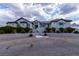Stunning home with a paved driveway, manicured bushes, and a grand entrance with stairs leading to the front door at 5865 Egan Crest Dr, Las Vegas, NV 89149
