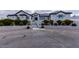 Beautiful home with a large paved driveway, mature manicured landscaping, and a grand entryway at 5865 Egan Crest Dr, Las Vegas, NV 89149