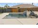 Sparkling backyard pool with clean lines, a waterfall feature, and ample patio space at 5865 Egan Crest Dr, Las Vegas, NV 89149