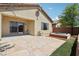 Backyard showcasing a stone patio, hot tub, and partial exterior view of the home at 6059 Wheat Penny Ave, Las Vegas, NV 89122