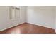 This empty bedroom has wood floors, a bright window, and is ready for furnishings at 6059 Wheat Penny Ave, Las Vegas, NV 89122