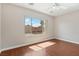 This spacious bedroom has wood floors, large window, and is ready for furnishings at 6059 Wheat Penny Ave, Las Vegas, NV 89122