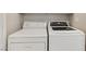 Functional laundry area featuring a side-by-side washer and dryer setup at 6059 Wheat Penny Ave, Las Vegas, NV 89122