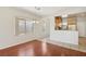 This living room offers wood flooring, bright windows and a passthrough to the kitchen at 6059 Wheat Penny Ave, Las Vegas, NV 89122