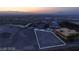 Aerial view of a property lot with mountain views and nearby community development at 611 Grand Rim Dr, Henderson, NV 89012