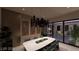 Dining room featuring stylish lighting, art, and a view of the zen garden at 611 Grand Rim Dr, Henderson, NV 89012