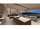 Modern kitchen features a large island, sleek countertops, and a seamless connection to the living area and outside view at 611 Grand Rim Dr, Henderson, NV 89012