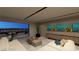 Inviting living room with comfortable seating, large windows, and a seamless connection to the outdoor patio at 611 Grand Rim Dr, Henderson, NV 89012
