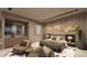 Well-appointed main bedroom features a sitting area and decor, offering a comfortable and stylish space at 611 Grand Rim Dr, Henderson, NV 89012