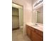 Bathroom featuring a single sink vanity and a toilet in an alcove for added privacy at 632 Hitchen Post Dr, Henderson, NV 89011