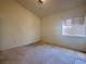 Bedroom with neutral colored walls, a standard-sized window, and neutral-colored carpet at 632 Hitchen Post Dr, Henderson, NV 89011