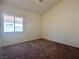 Bedroom featuring a window and neutral carpet and paint at 632 Hitchen Post Dr, Henderson, NV 89011