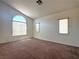 Bright bedroom with large windows and neutral carpeting at 632 Hitchen Post Dr, Henderson, NV 89011