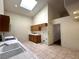 Functional kitchen with white appliances, tile flooring, and a skylight at 632 Hitchen Post Dr, Henderson, NV 89011