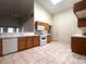 Functional kitchen with white appliances and tile flooring at 632 Hitchen Post Dr, Henderson, NV 89011
