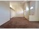 Open living area featuring soaring ceilings and a hanging light fixture at 632 Hitchen Post Dr, Henderson, NV 89011