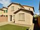 Backyard featuring low maintenance landscaping with artificial turf, and a peach stucco wall at 7253 Blooming Jasmine Ave, Las Vegas, NV 89117