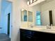 Bathroom featuring double sinks with large mirrors at 7253 Blooming Jasmine Ave, Las Vegas, NV 89117