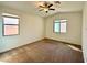 Cozy bedroom featuring neutral tones, plush carpeting, and two windows at 7253 Blooming Jasmine Ave, Las Vegas, NV 89117