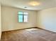 Sunlit bedroom with neutral walls and carpeted flooring at 7253 Blooming Jasmine Ave, Las Vegas, NV 89117