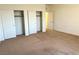 Bedroom with carpeted floors, neutral walls and closet with sliding doors at 7253 Blooming Jasmine Ave, Las Vegas, NV 89117