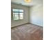 Carpeted bedroom with a window for natural light at 7253 Blooming Jasmine Ave, Las Vegas, NV 89117