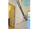 Bright entryway features soaring ceilings, tile floors, and a staircase with decorative black banister at 7253 Blooming Jasmine Ave, Las Vegas, NV 89117
