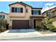 Charming two-story home featuring a two-car garage and beautiful landscaping at 7253 Blooming Jasmine Ave, Las Vegas, NV 89117