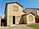 Backyard featuring low maintenance landscaping with artificial turf, and a peach stucco wall at 7253 Blooming Jasmine Ave, Las Vegas, NV 89117