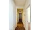 Neutral hallway with multiple doors at 7253 Blooming Jasmine Ave, Las Vegas, NV 89117