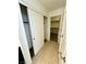Hallway with tile flooring and a coat closet with sliding doors plus a walk in closet at 7253 Blooming Jasmine Ave, Las Vegas, NV 89117