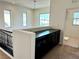 Upstairs landing with a built-in black cabinet and carpeted floors at 7253 Blooming Jasmine Ave, Las Vegas, NV 89117