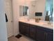 Bathroom with double sinks, modern fixtures, and a large mirror at 7334 N Decatur Blvd # 6, Las Vegas, NV 89131