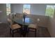 Cozy dining area with a glass table, white chairs, and ample natural light at 7334 N Decatur Blvd # 6, Las Vegas, NV 89131