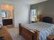 Comfortable main bedroom with a bed, bedside tables, and access to an en-suite bathroom at 7334 N Decatur Blvd # 6, Las Vegas, NV 89131