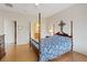 Charming primary bedroom with a four-poster bed and ensuite bath creating a peaceful sanctuary at 7452 Chaffinch St, North Las Vegas, NV 89084