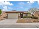 Charming single-story home with a desert landscaped yard and a two-car garage at 7452 Chaffinch St, North Las Vegas, NV 89084