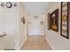 Inviting hallway with tiled floors and decorative wall art leading to the main entrance at 7452 Chaffinch St, North Las Vegas, NV 89084
