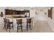 Spacious kitchen with a breakfast bar, tile backsplash, and stainless steel appliances at 7452 Chaffinch St, North Las Vegas, NV 89084