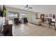 Well-lit living area connected to dining and kitchen, with stylish tile flooring at 7452 Chaffinch St, North Las Vegas, NV 89084
