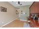 An airy home office features wood flooring and a custom-built wooden desk at 7452 Chaffinch St, North Las Vegas, NV 89084