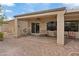 Relaxing covered patio with comfortable seating and charming garden views at 7452 Chaffinch St, North Las Vegas, NV 89084