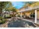 The backyard has a covered patio, a large shed and mature trees for shade at 810 Socorro Song Ln, Henderson, NV 89052